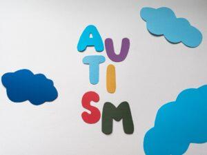 letters and clouds cutouts on a white paper